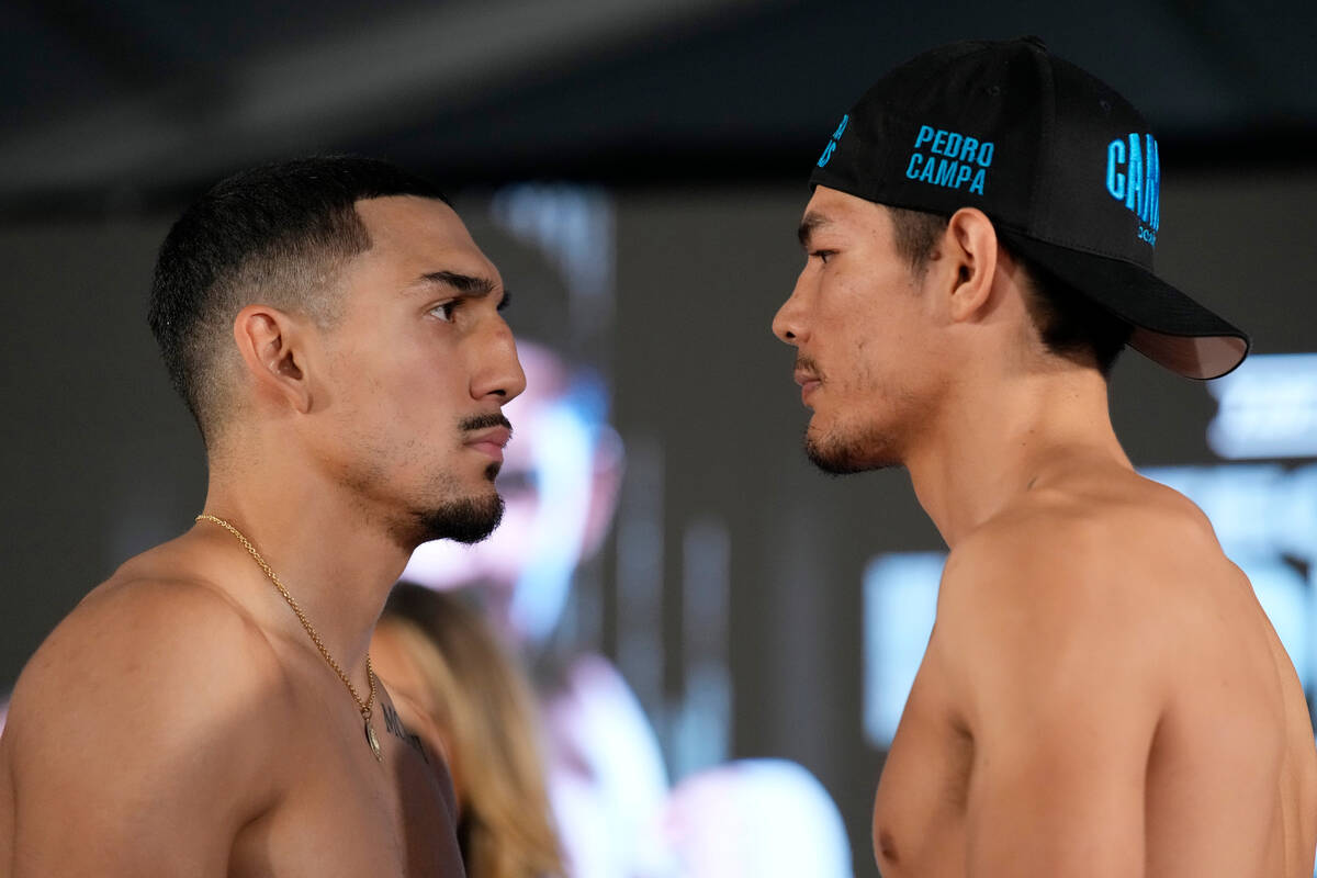 Pedro Campa, right, and Teofimo Lopez pose during a weigh-in for their junior welterweight boxi ...
