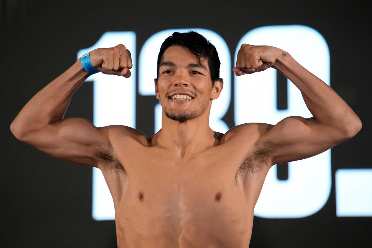 Pedro Campa poses on the scale during a weigh-in for a junior welterweight boxing match, Friday ...