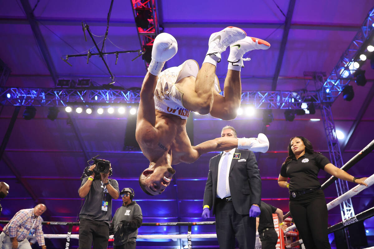 Teofino Lopez does a backflip after his technical knockout victory against Pedro Campa in the s ...