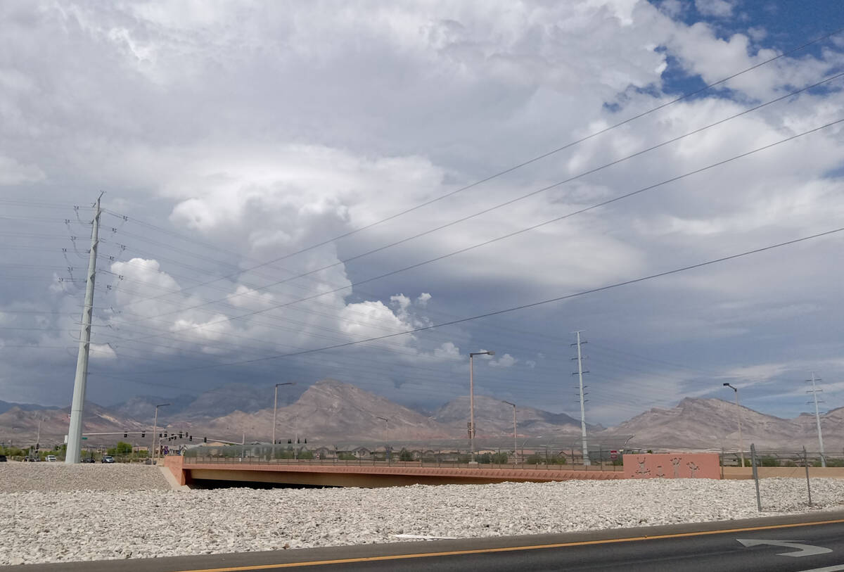 Potential threatening clouds move over the Spring Mountains on Sunday, Aug. 14, 2022. The Mount ...