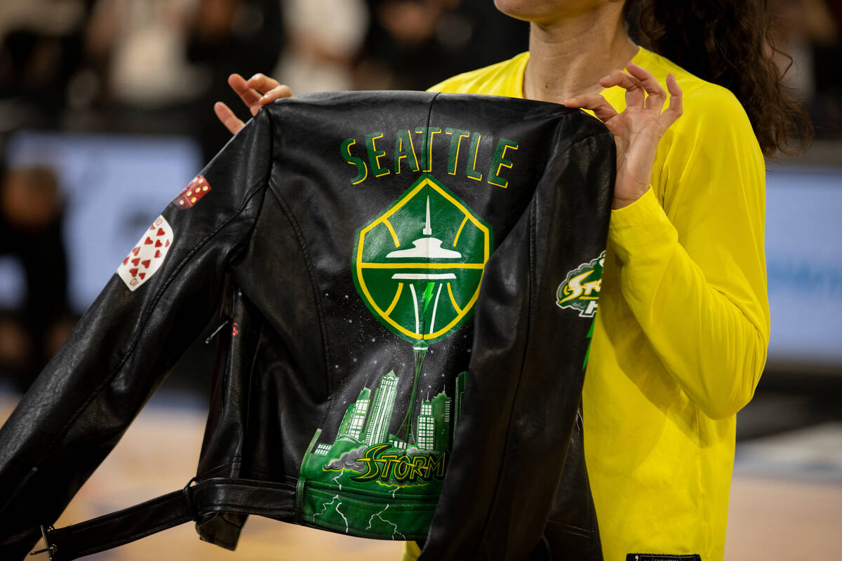 The Las Vegas Aces gift Seattle's Sue Bird a custom leather jacket before the last regular seas ...