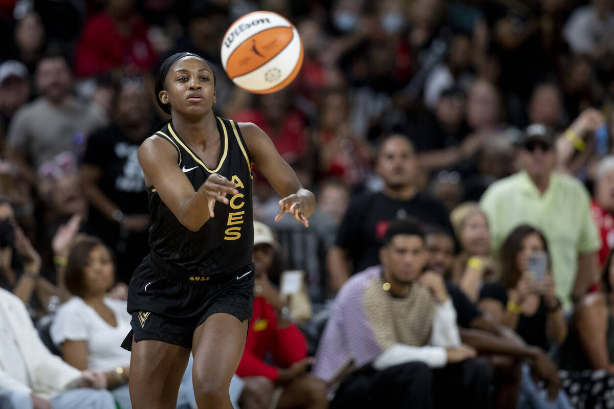 Las Vegas Aces guard Jackie Young (0) passes the ball as the Aces face the Seattle Storm in the ...
