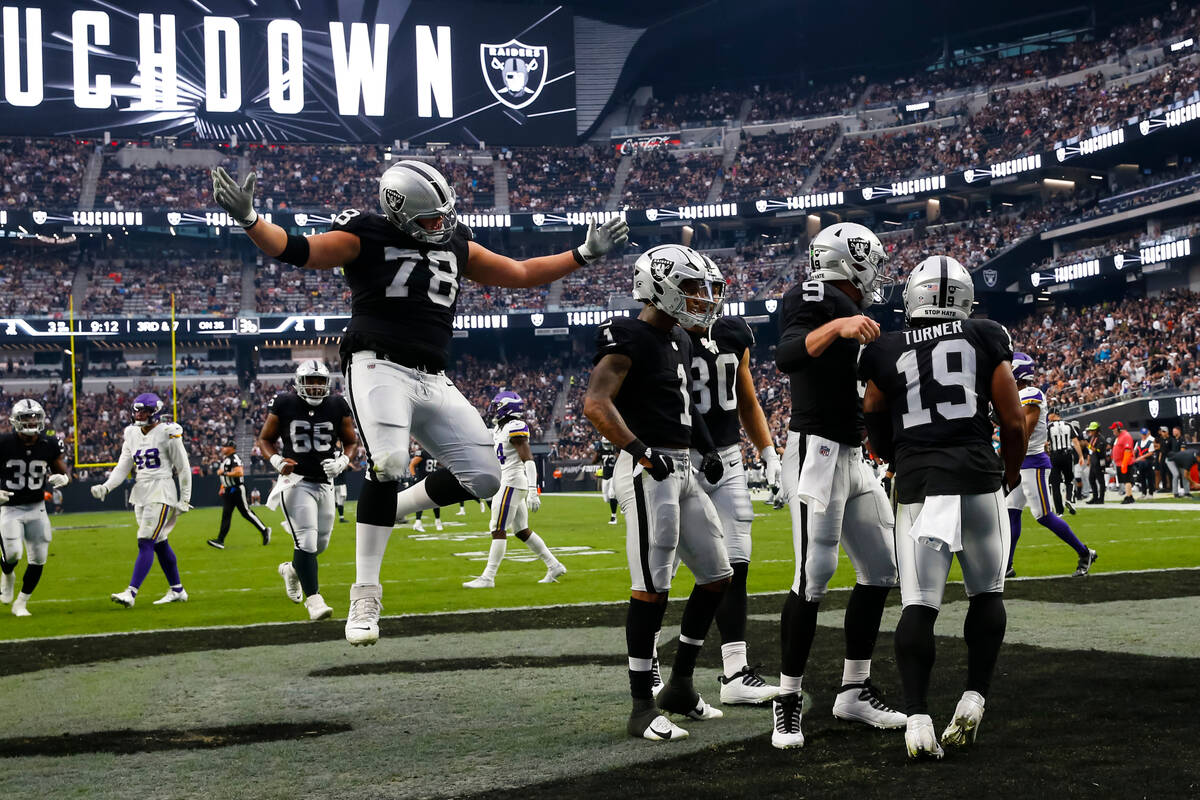 Raiders wide receiver DJ Turner (19) celebrates his touchdown with teammates during the second ...