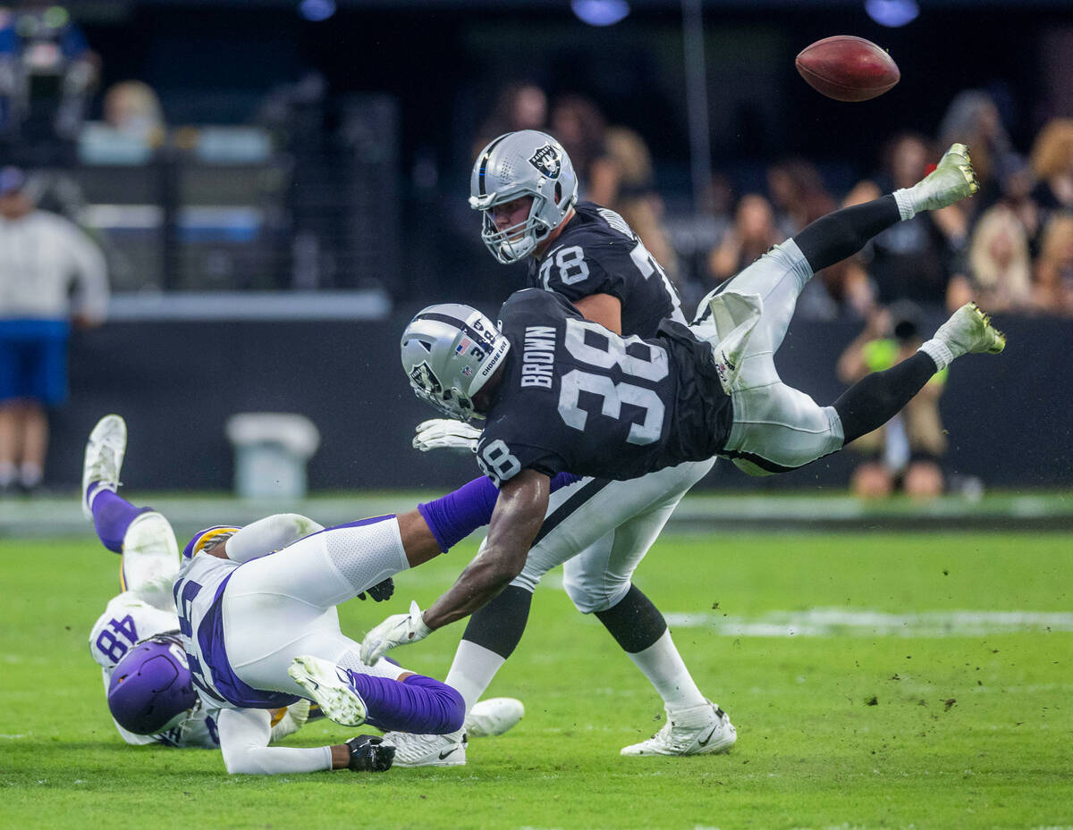 Raiders running back Brittain Brown (38) fumbles the ball after a collision with the Vikings sa ...