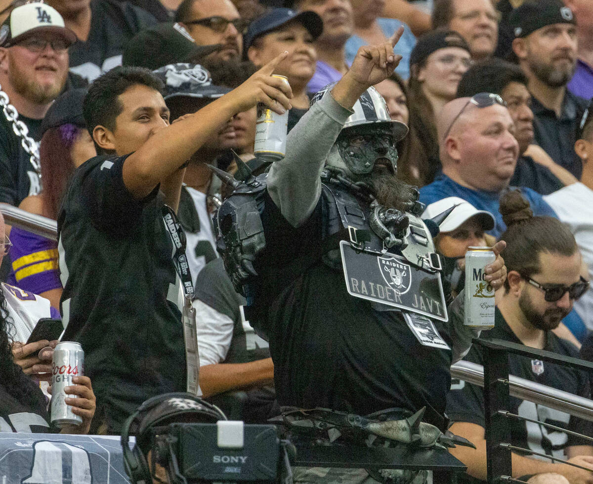Raider fans cheer during the first half of a preseason NFL game against the Minnesota Vikings a ...