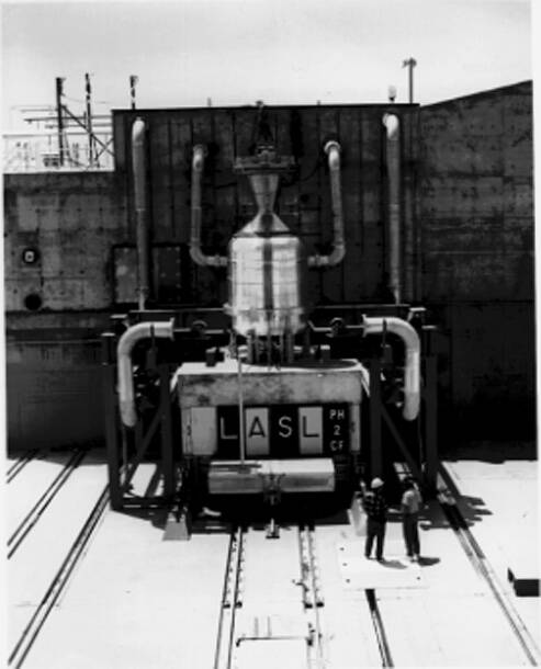A nuclear reactor sitting on a test cell pad prior to preliminary tests at the Nevada Test Site ...