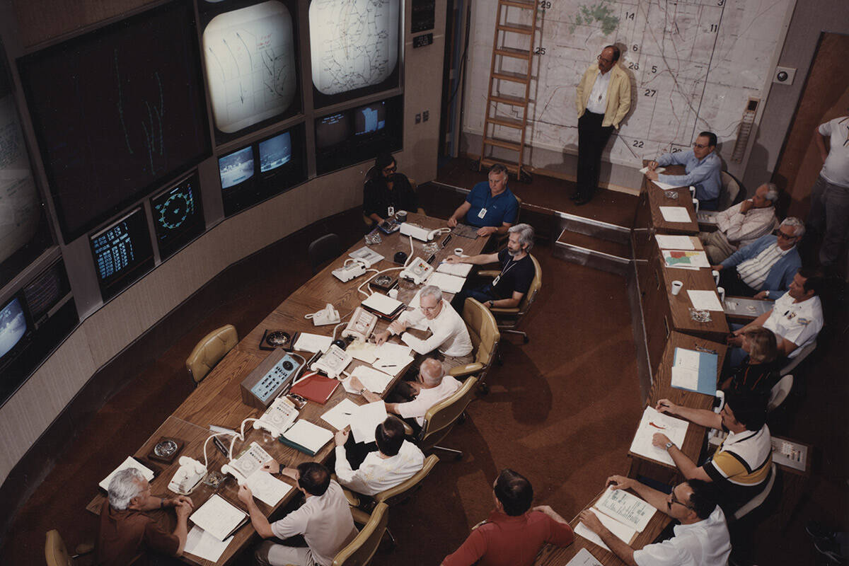 Inside the Control Point at the Nevada Test Site the Test Controller (at table) prepares to con ...