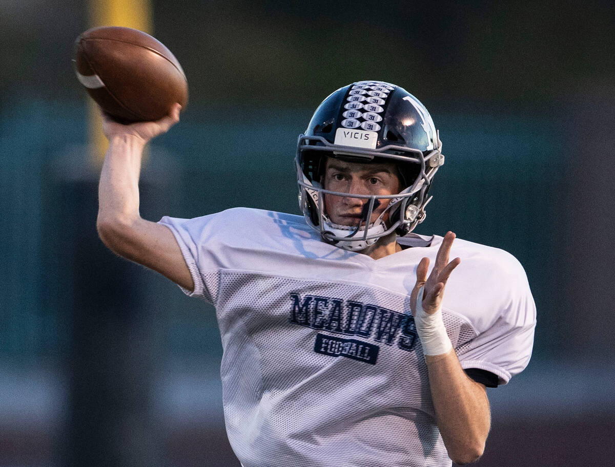 In this Nov. 16, 2021, file photo, The Meadows High School quarterback Sean Gosse throws the b ...