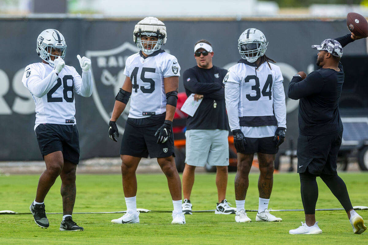In this July 23, 2022, file photo, Raiders running back Josh Jacobs (28) runs a drill as teamma ...