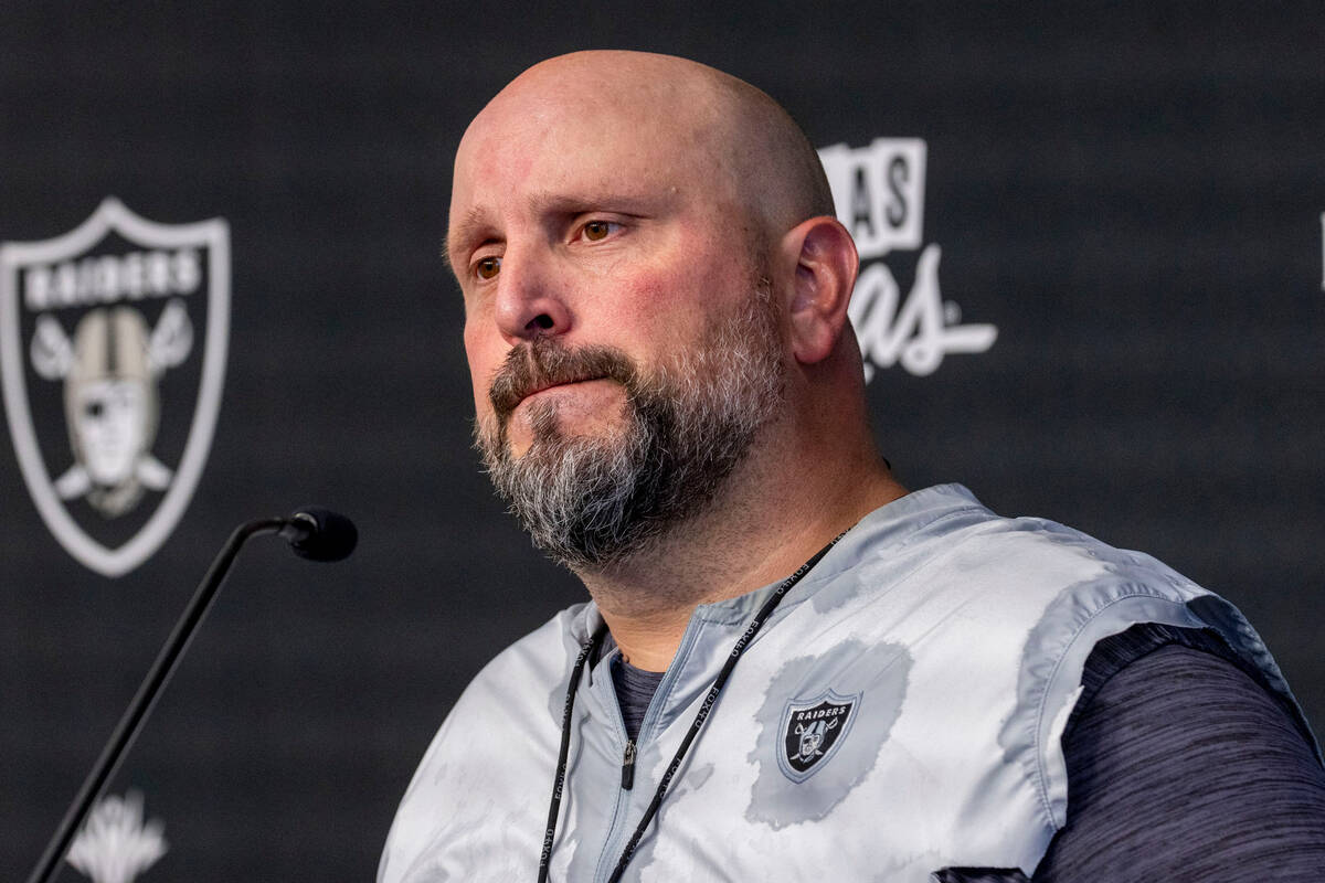 Raiders offensive line coach Carmen Bricillo takes questions during a news conference at the In ...