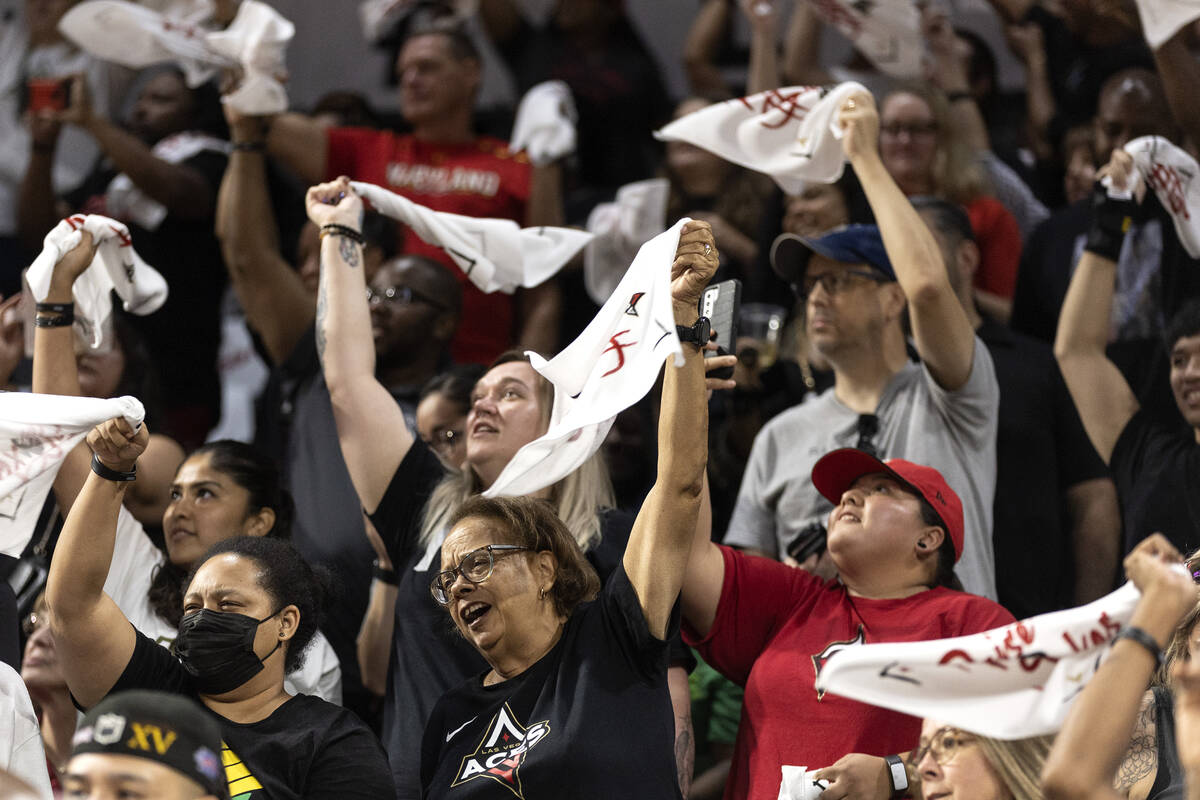 Las Vegas Aces fans cheer for their team during the first half of a WNBA basketball game agains ...