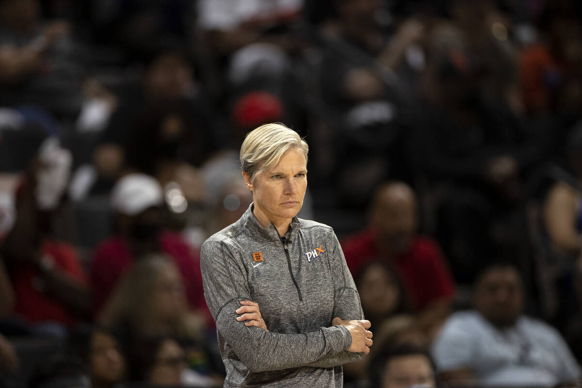 Phoenix Mercury head coach Vanessa Nygaard watches as referees discuss a foul during the second ...