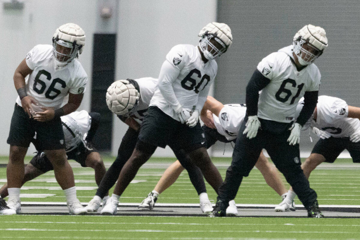 Raiders guard Dylan Parham (66), offensive tackle Tyrone Wheatley Jr. (60) and guard Jordan Mer ...