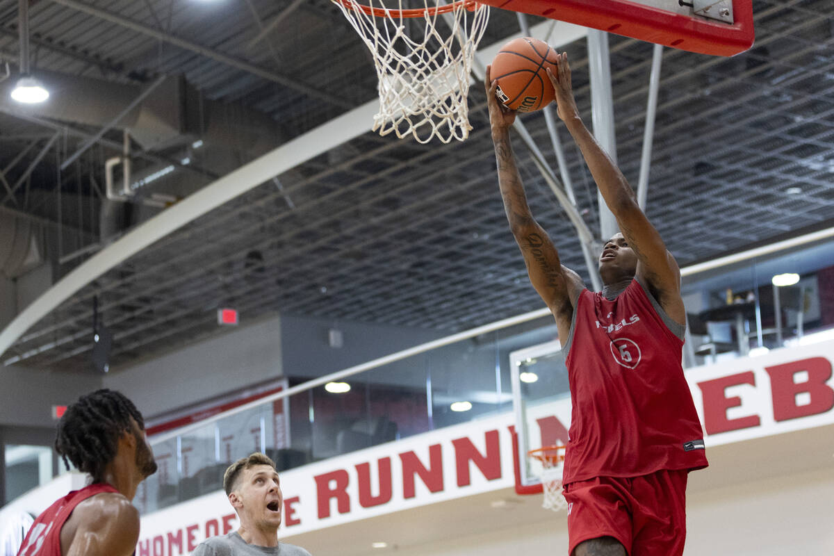 UNLV's Luis Rodriguez (15) goes up for a dunk during a team basketball practice at Mendenhall C ...