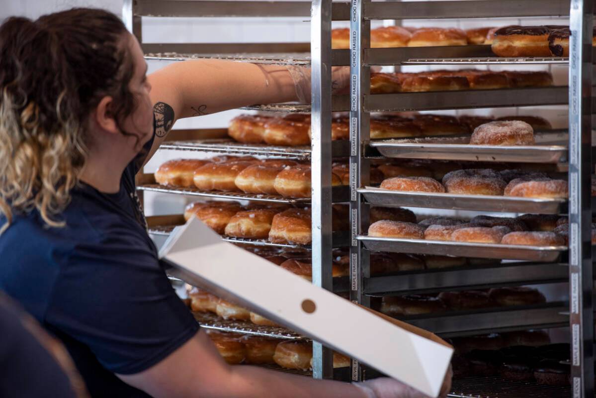 Ren Martin packs a box for a customer at Randy's Donuts on South Rainbow Boulevard on Friday, A ...