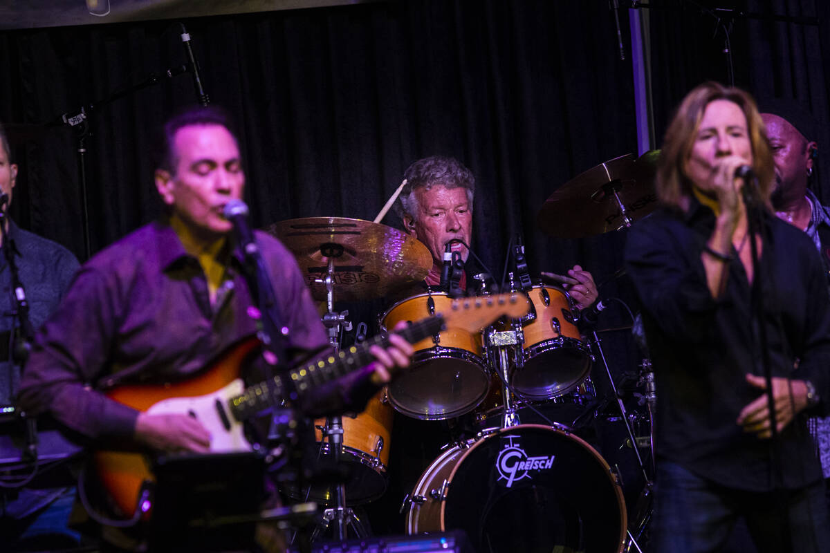 Drummer Johnny Friday of the Santa Fe & The Fat City Horns, center, plays with the band dur ...