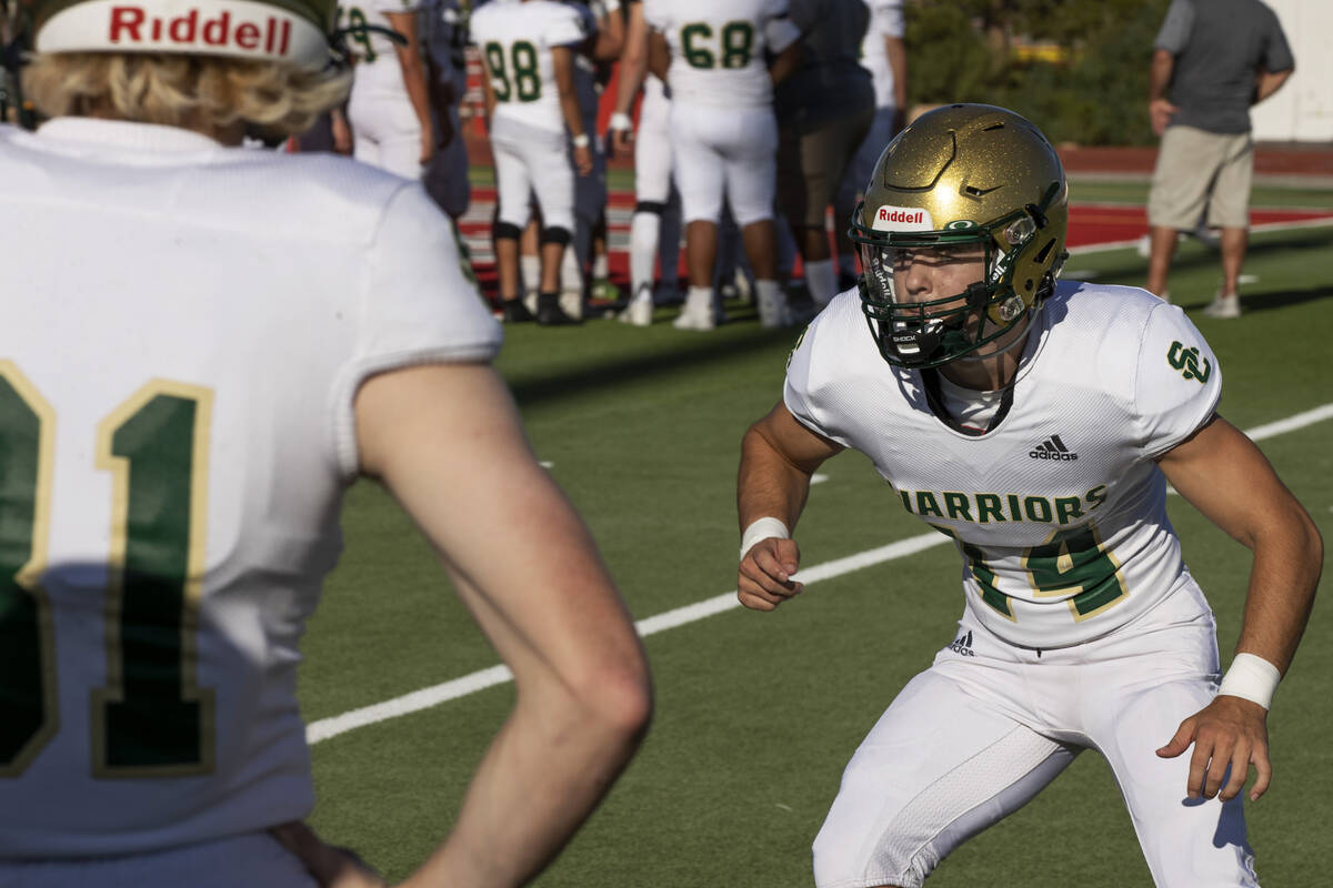 Snow Canyon High School's Will West (14) warms up before their game against the Arbor View Aggi ...