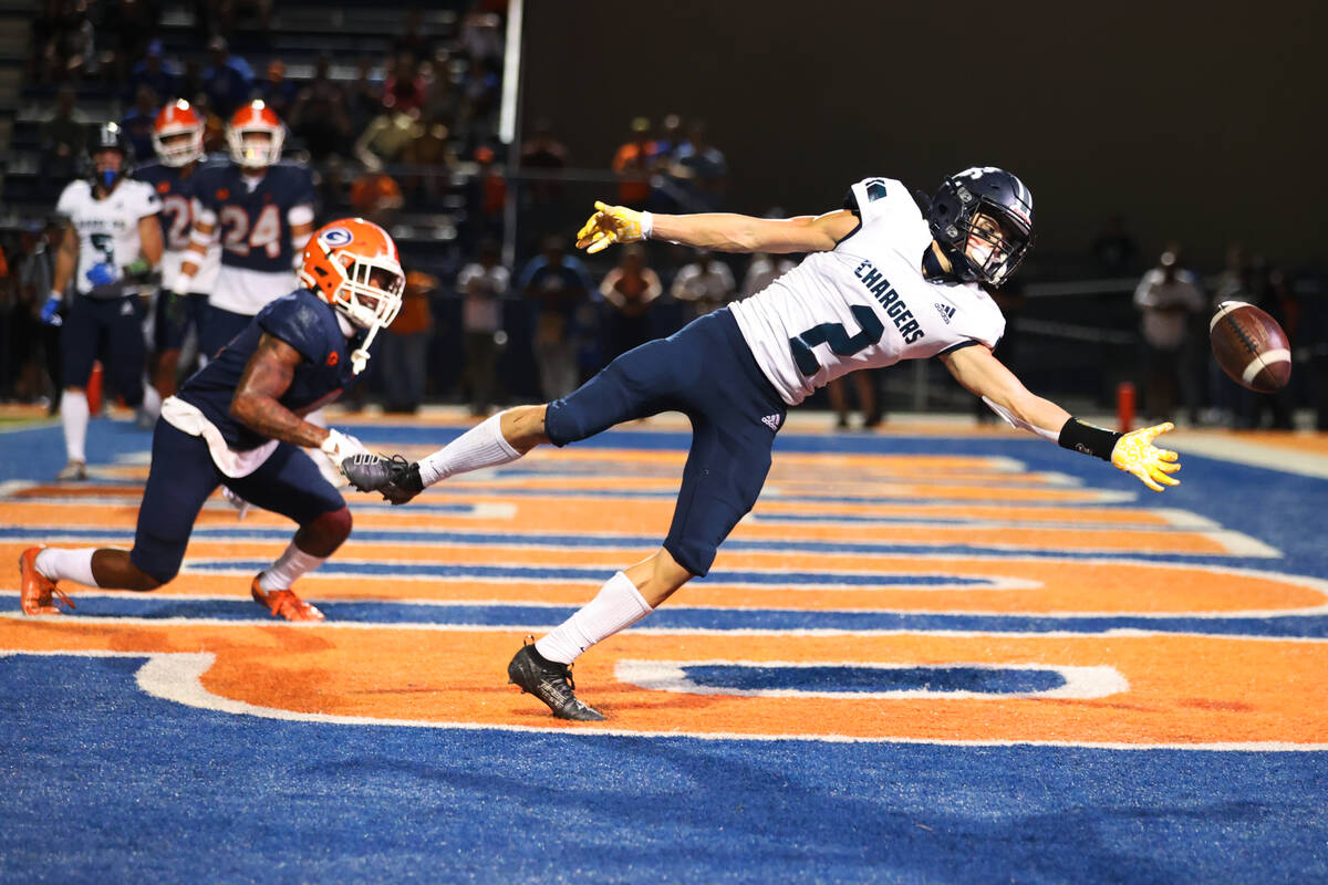 Corner Canyon's Tate Kjar (2) misses a pass in the end zone while under pressure from Bishop Go ...