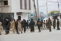 Soldiers patrol outside the Hayat Hotel in Mogadishu, Somalia, Saturday, Aug. 20, 2022. At leas ...
