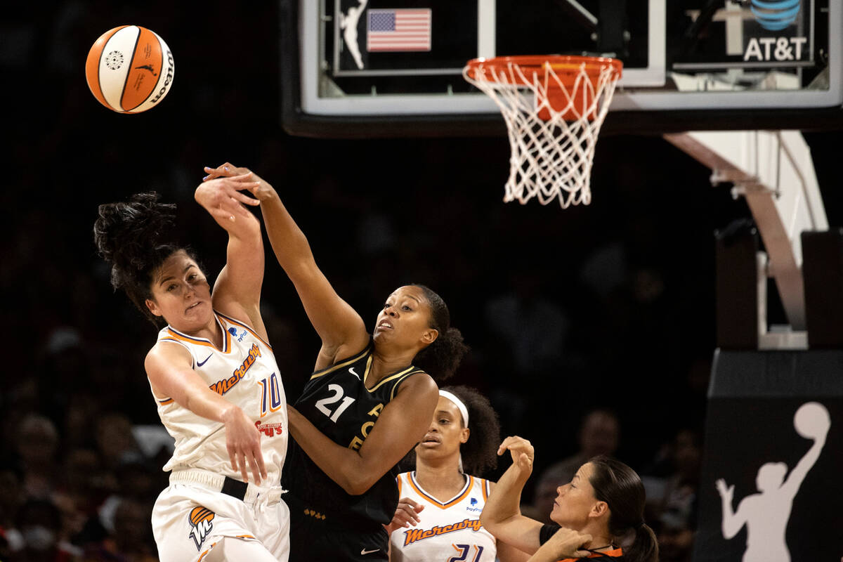 Las Vegas Aces center Iliana Rupert (21) wins a jump ball against Phoenix Mercury center Megan ...