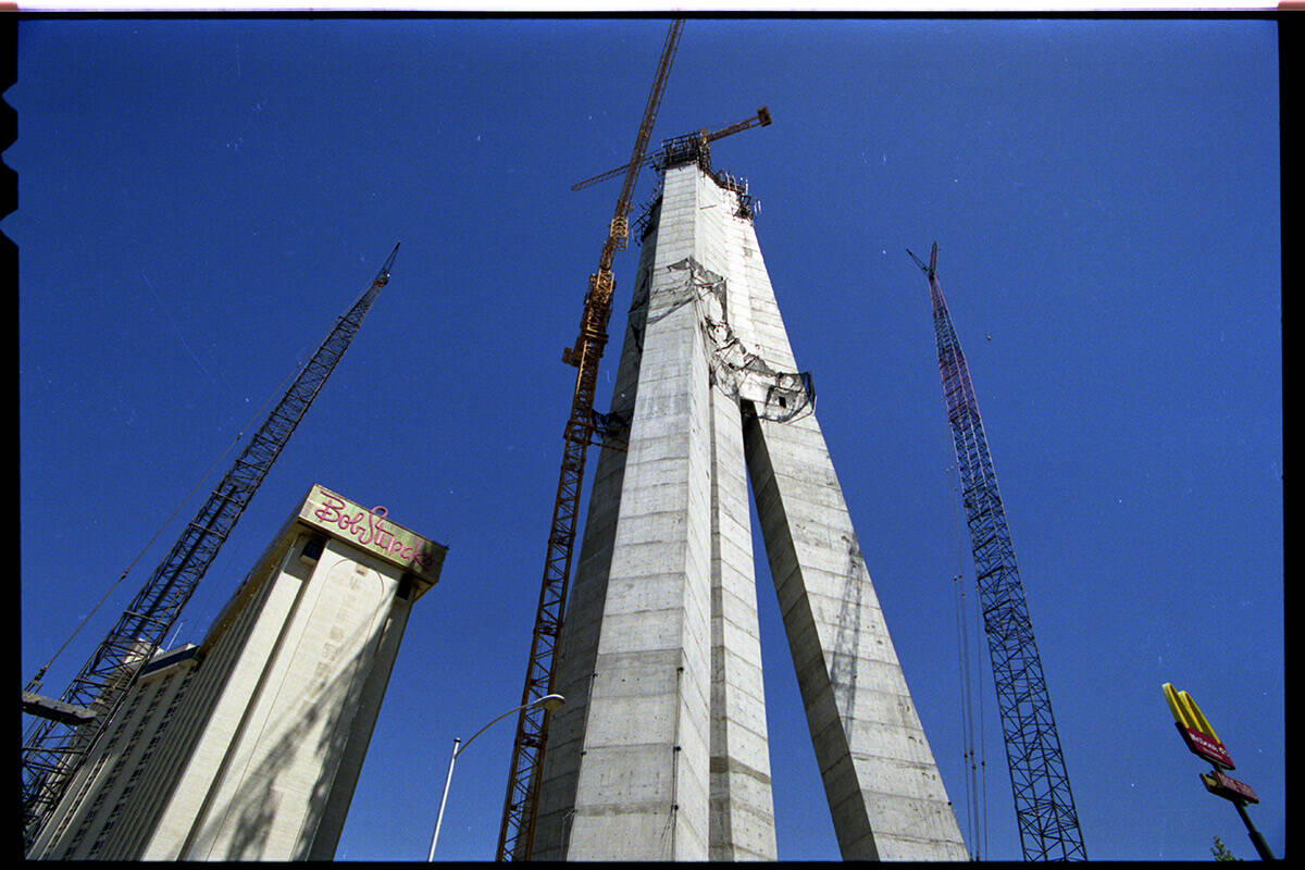 A giant crane next to the Stratosphere Tower that is building itself by inserting 20 foot secti ...