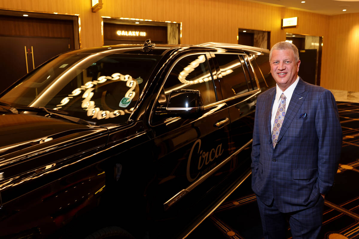CEO Derek Stevens with a Cadillac Escalade in the pre-function area at the new meetings and con ...
