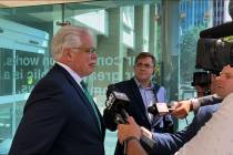 Attorney Christopher Gibbons, left, representing Adam Fox, speaks with the media outside the fe ...