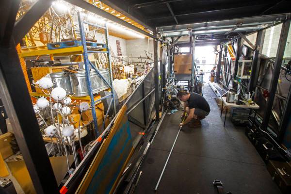 Bill Bayer, of Oakland, Calif., works on The Metaphoenix art car, in preparation for Burning Ma ...