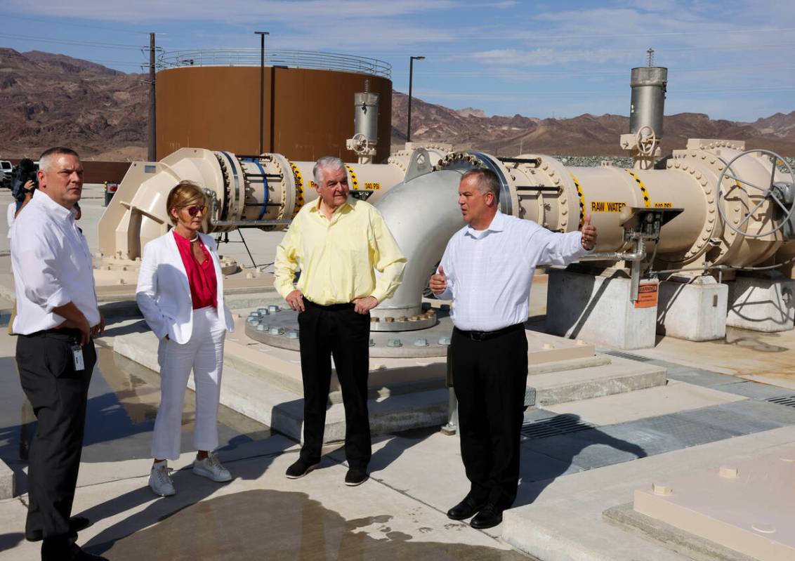 Nevada Gov. Steve Sisolak, second from right, tours the Southern Nevada Water Authority new low ...