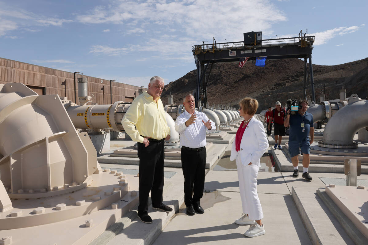Nevada Gov. Steve Sisolak, left, tours the Southern Nevada Water Authority new low-lake-level p ...