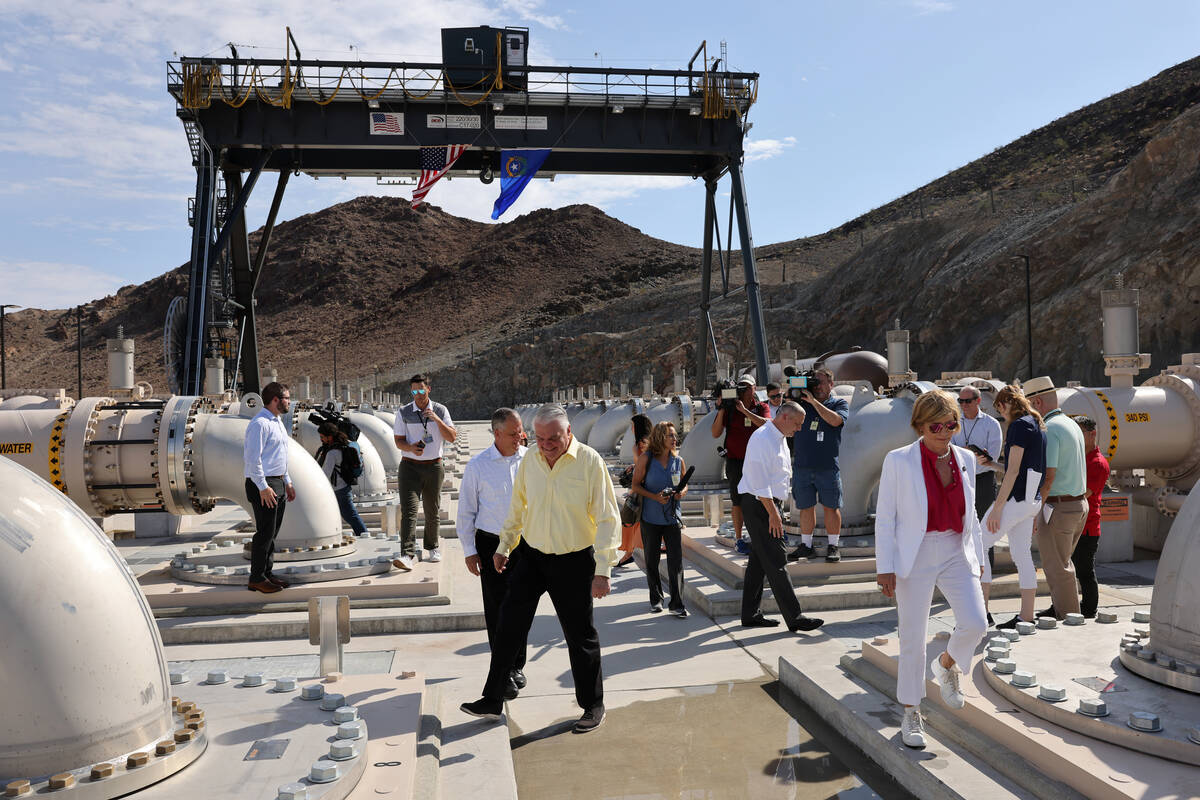 Nevada Gov. Steve Sisolak, center, tours the Southern Nevada Water Authority new low-lake-level ...