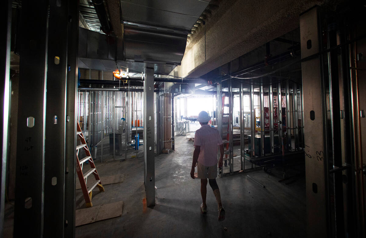 Developer Brett Torino, center right, walks through the under-construction Ocean Prime steakhou ...