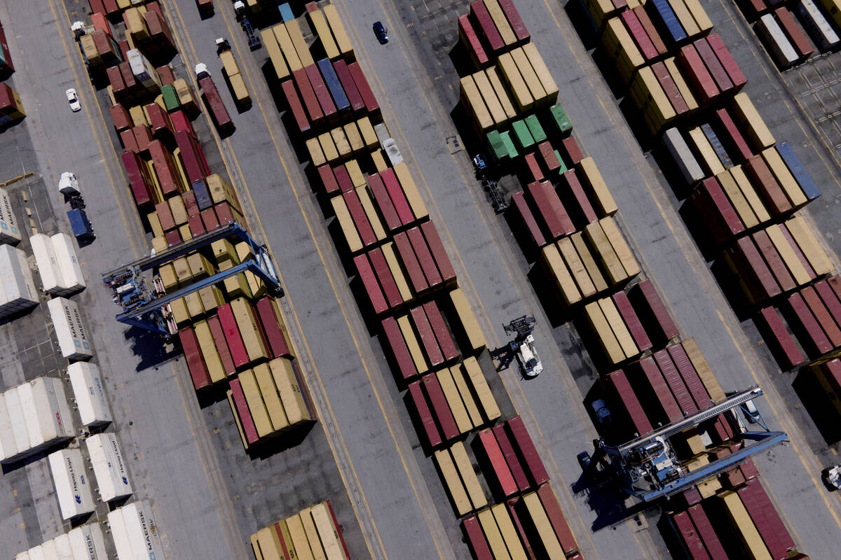 Shipping containers are stacked together at the Port of Baltimore, Friday, Aug. 12, 2022, in Ba ...