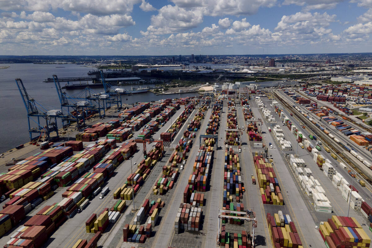 Shipping containers are stacked together at the Port of Baltimore, Friday, Aug. 12, 2022, in Ba ...