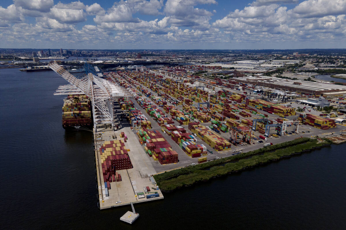 Shipping containers are stacked together at the Port of Baltimore, Friday, Aug. 12, 2022, in Ba ...