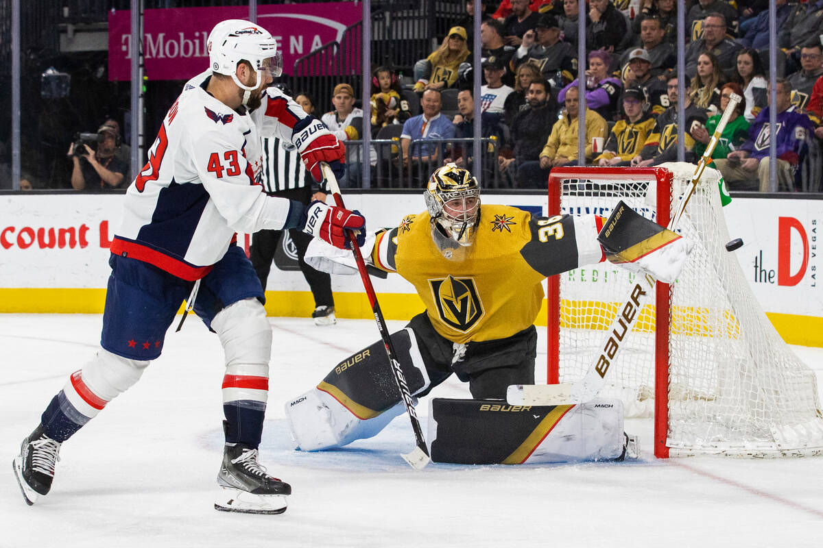 Golden Knights goaltender Logan Thompson (36) makes a save against Washington Capitals right wi ...