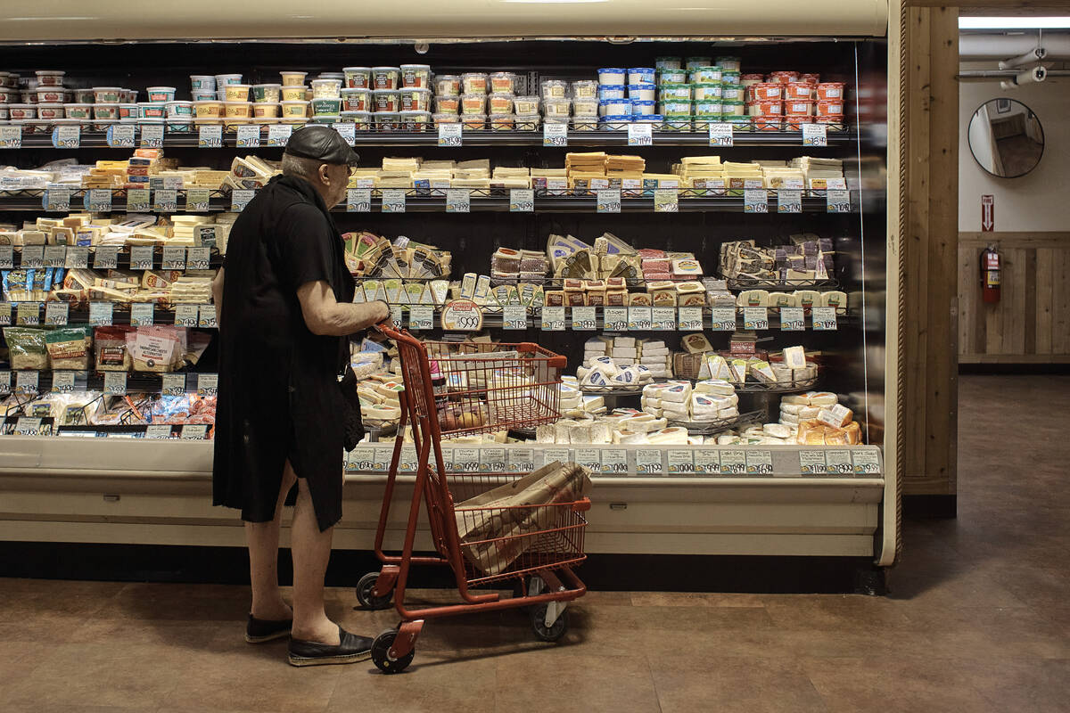 A man shops at a supermarket on Wednesday, July 27, 2022, in New York. An inflation gauge that ...