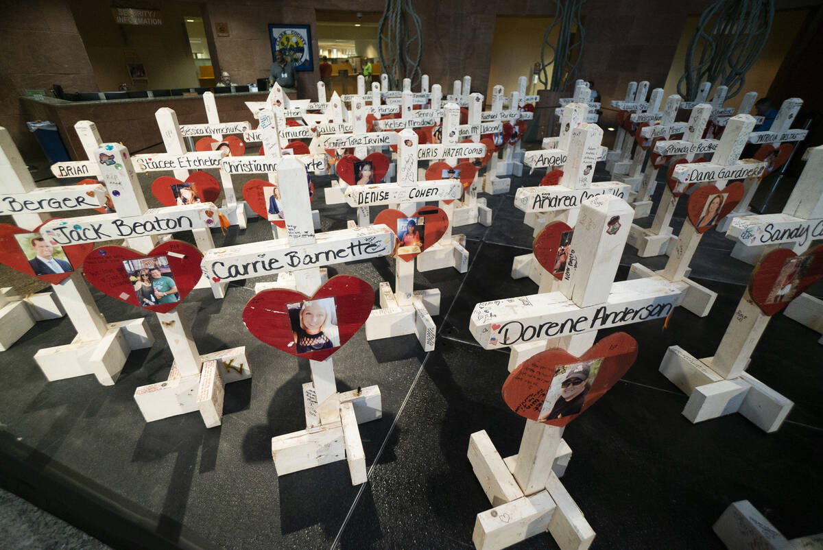 Crosses that were previously put up at the "Welcome to Fabulous Las Vegas" sign photographed on ...