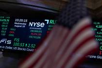 FILE - A screen displays market data at the New York Stock Exchange in New York, Wednesday, Aug ...