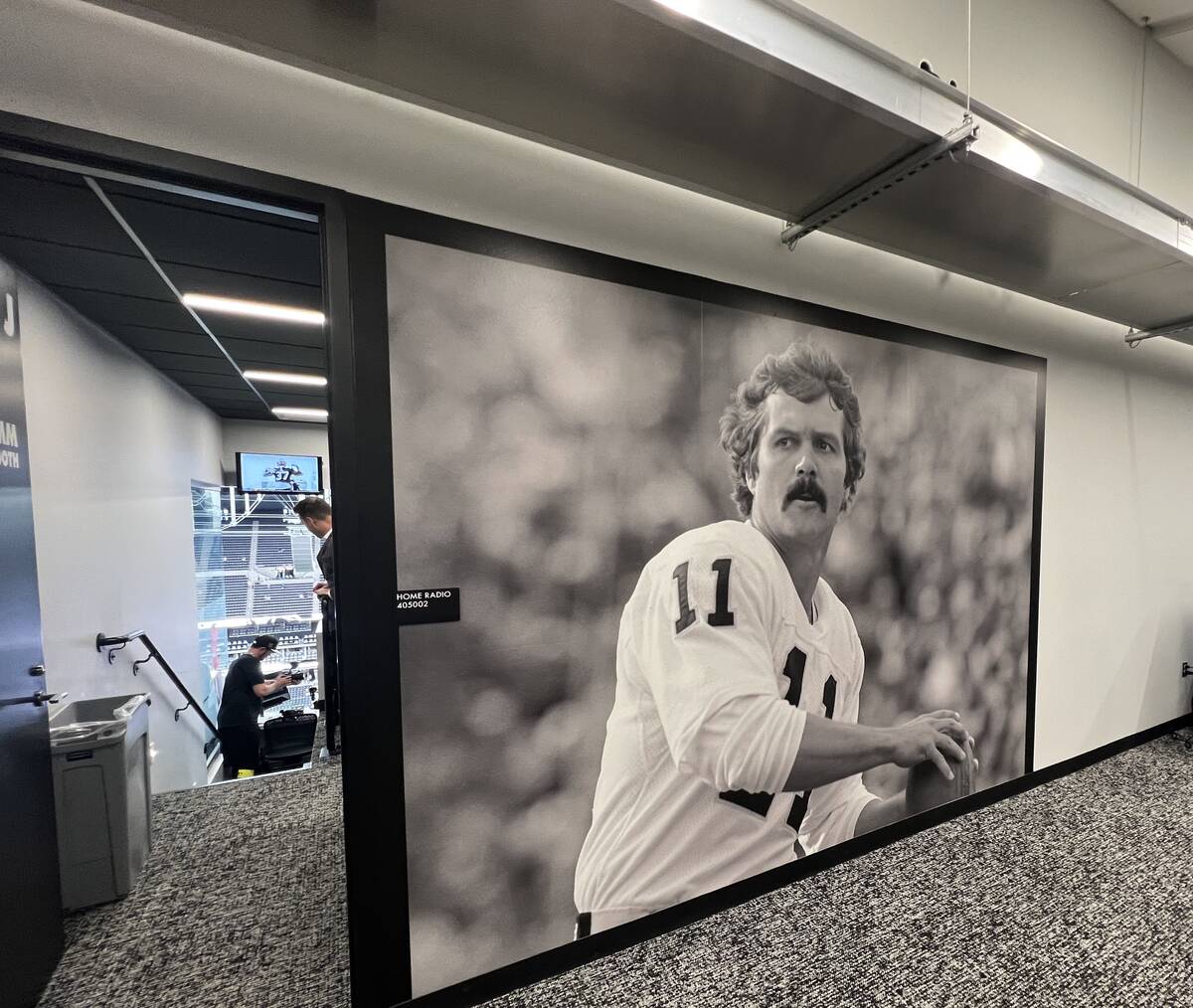 David Humm's portrait is shown at the dedication of David Humm Broadcast Booth at Allegiant Sta ...