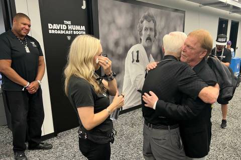 Las Vegas Raiders owners Mark Davis hugs Tom Humm, brother of ex-UNLV and Oakland Raiders great ...