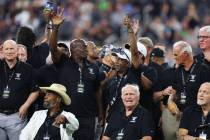 Raiders alumni are honored during halftime of a NFL preseason football game between the Raiders ...