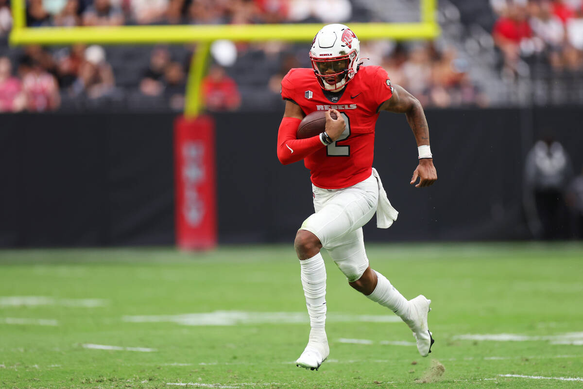 UNLV Rebels quarterback Doug Brumfield (2) runs the ball against the Idaho State Bengals during ...