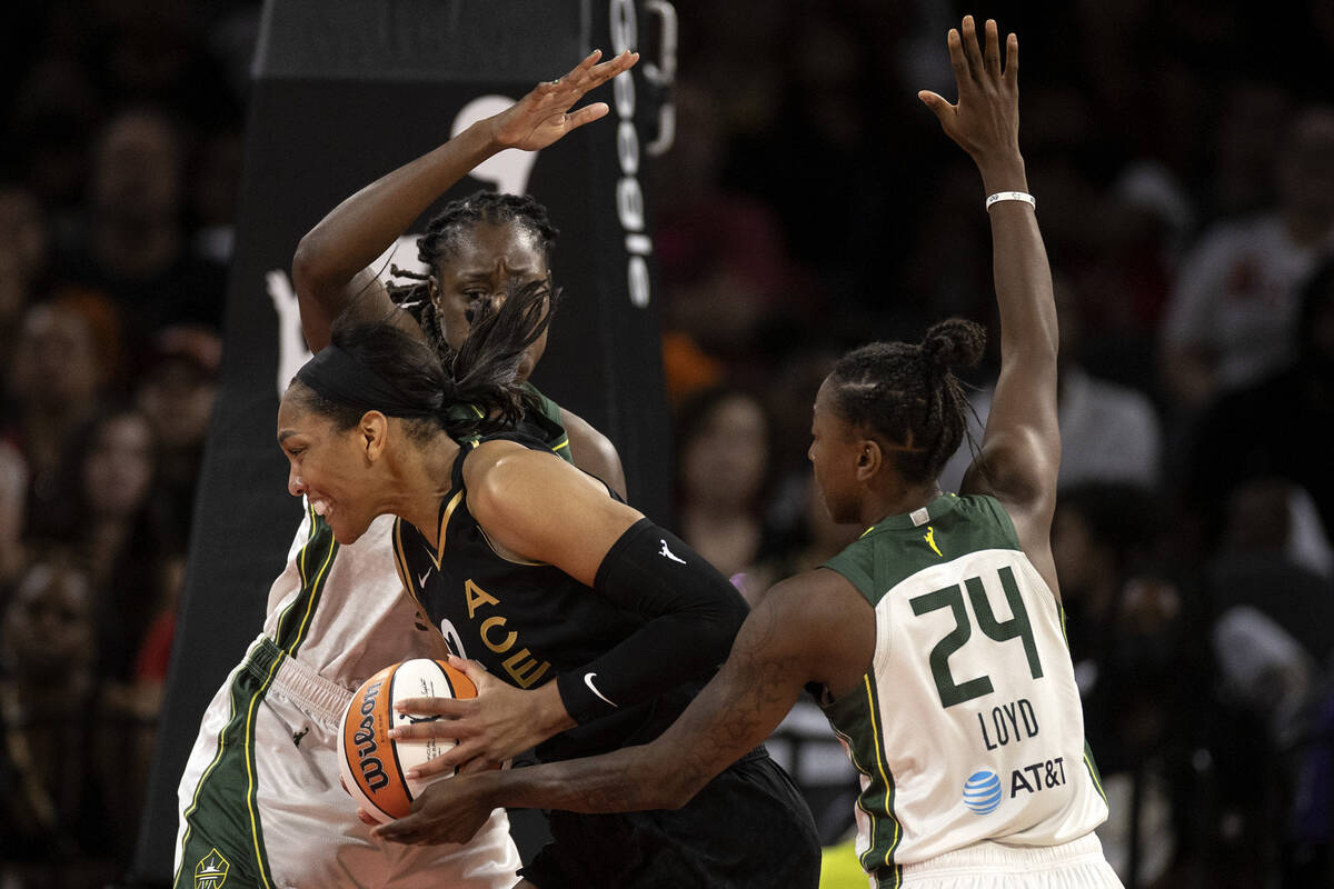 Las Vegas Aces forward A'ja Wilson (22) attempts to shoot against Seattle Storm center Tina Cha ...