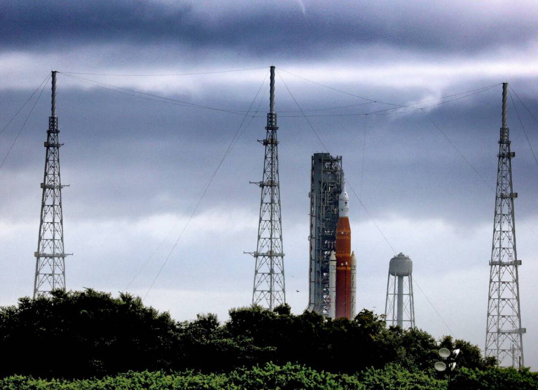 Storm clouds linger over Artemis I, NASA's Space Launch System heavy-lift rocket carrying the O ...