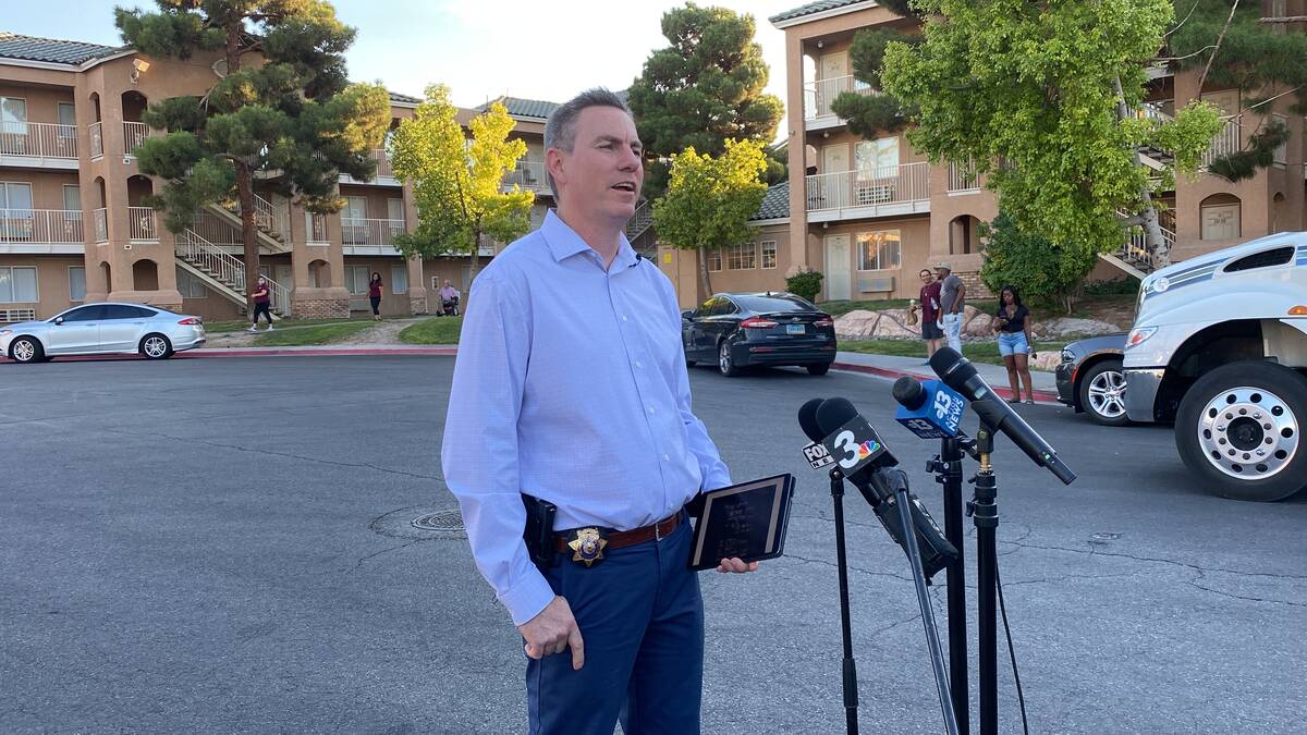 Metropolitan Police Department Lt. Jason Johansson speaks with the media during a homicide inve ...