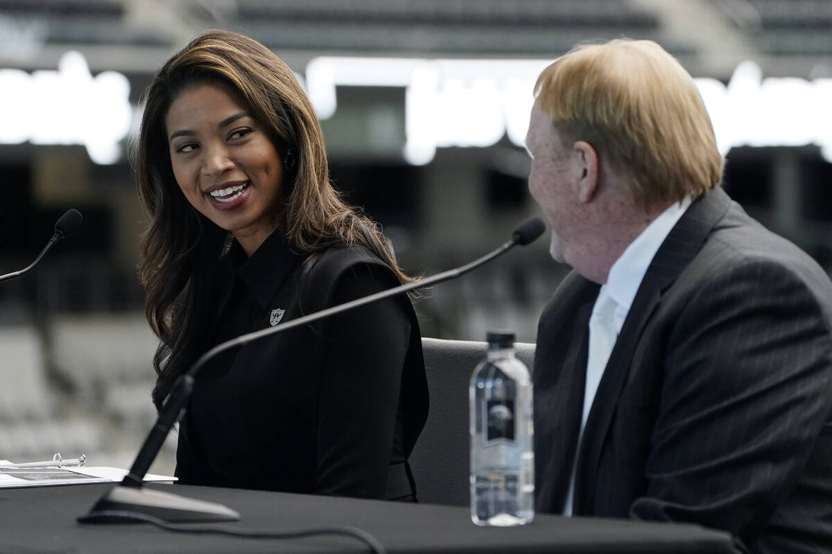 Sandra Douglass Morgan, left, speaks beside Las Vegas Raiders owner Mark Davis during a news co ...