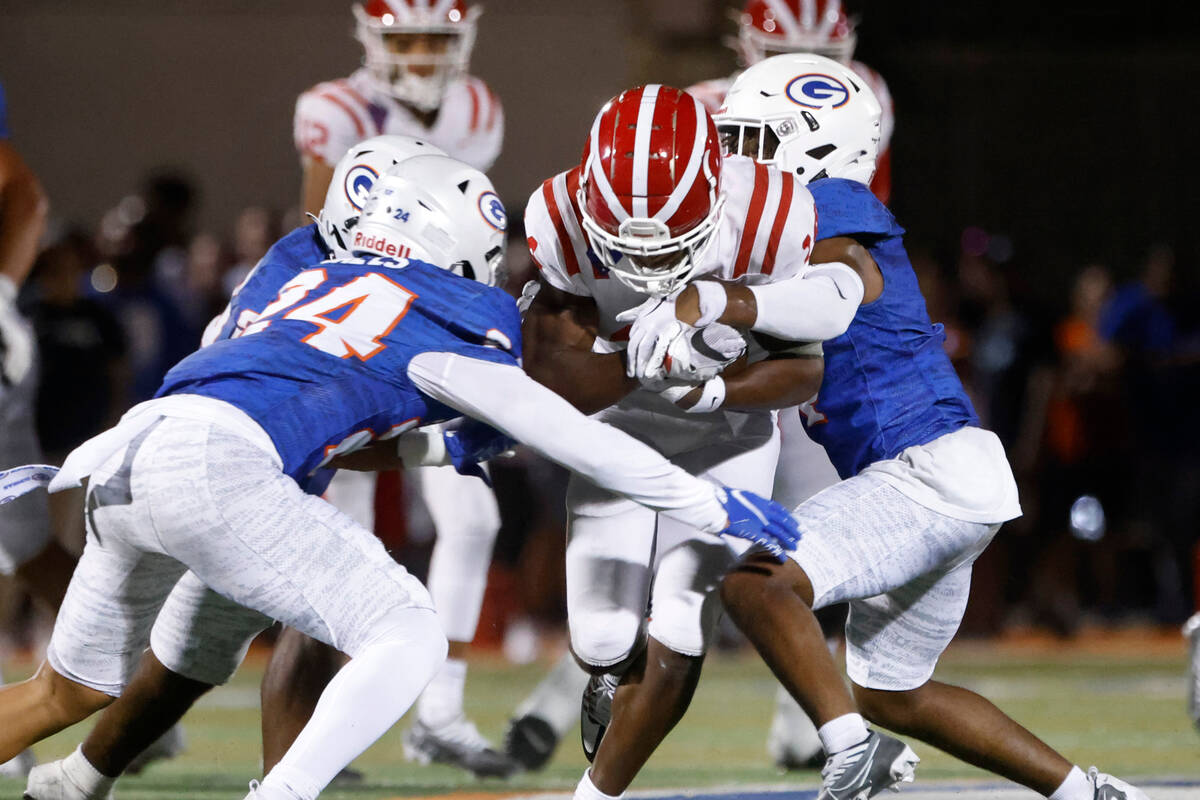 Mater Dei's wide receiver Jordan Onovughe (14) runs through Bishop Gorman defends during the se ...