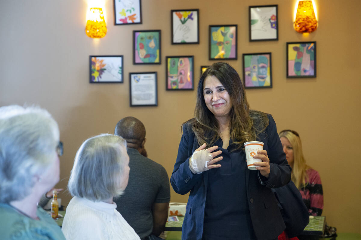 City councilwoman Victoria Seaman converses with Ward 2 constituents during a breakfast at Rach ...