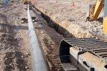 A construction crew digs a trench for replacing a Southwest Gas pipeline in the area of the Jer ...